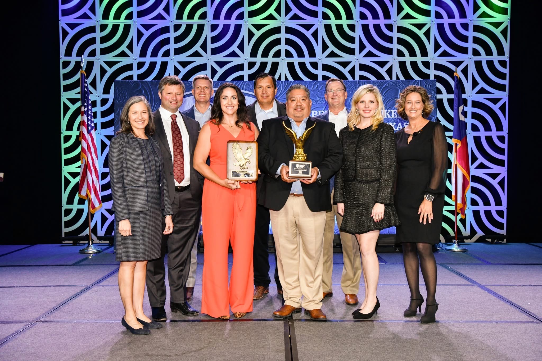 TexasBank team accepting statewide Best of Community Banking Award on stage with plaques and trophies.